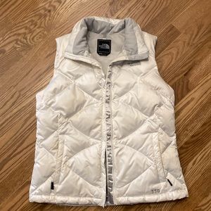 White north face puffer vest with secure inside pocket. Light gray lining.